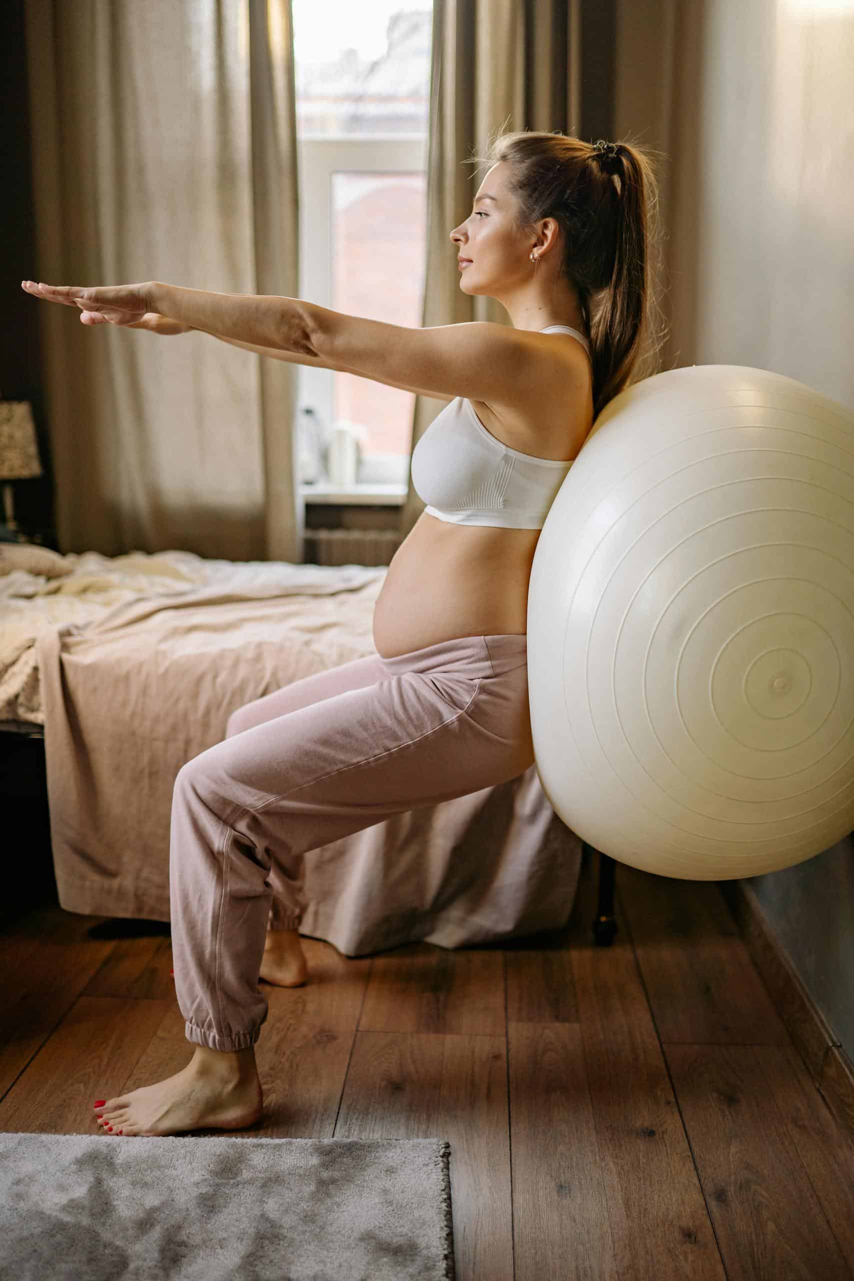 Pre & postnatal personal training in Calgary with guided strength exercises during pregnancy.