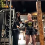 Garima coaching client Jennifer doing a Pallof press exercise